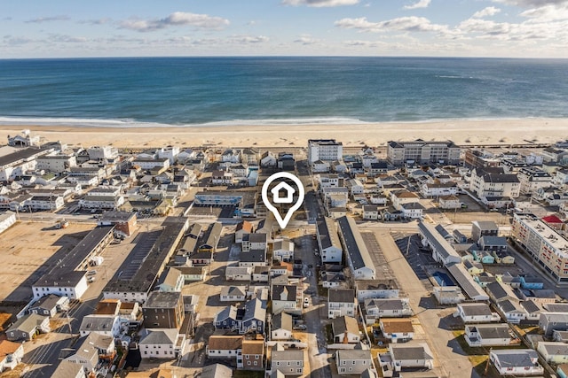 bird's eye view featuring a beach view and a water view