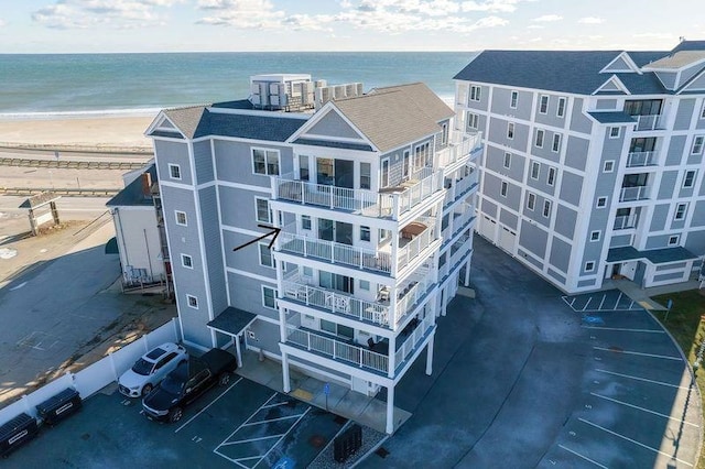 bird's eye view with a water view and a view of the beach