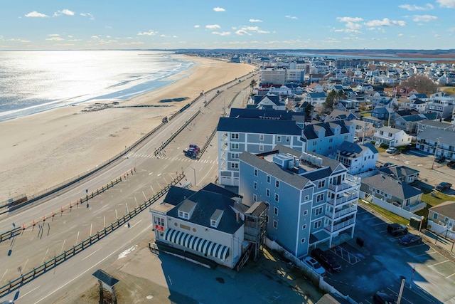 bird's eye view with a water view and a view of the beach