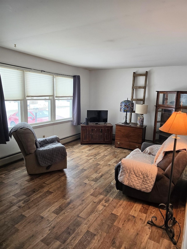 living room with dark hardwood / wood-style flooring and baseboard heating