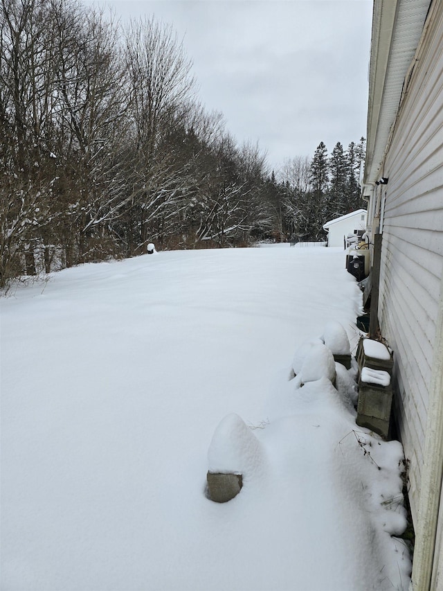 view of yard layered in snow