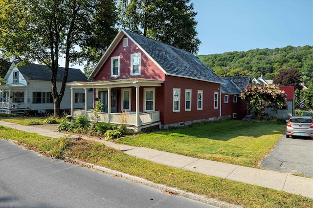 view of front of house featuring a porch and a front yard