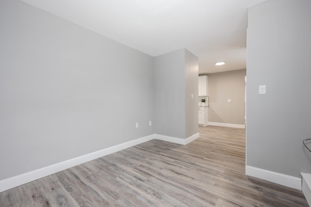 spare room featuring light hardwood / wood-style flooring