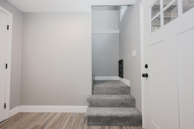 stairway featuring hardwood / wood-style floors