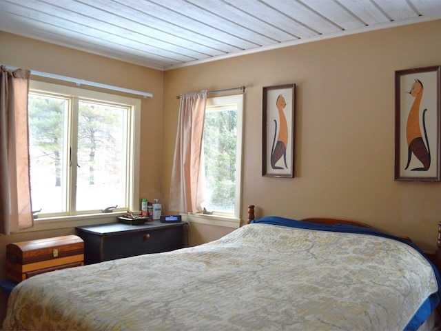 bedroom with multiple windows