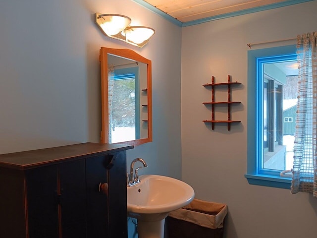 bathroom featuring sink and wood ceiling