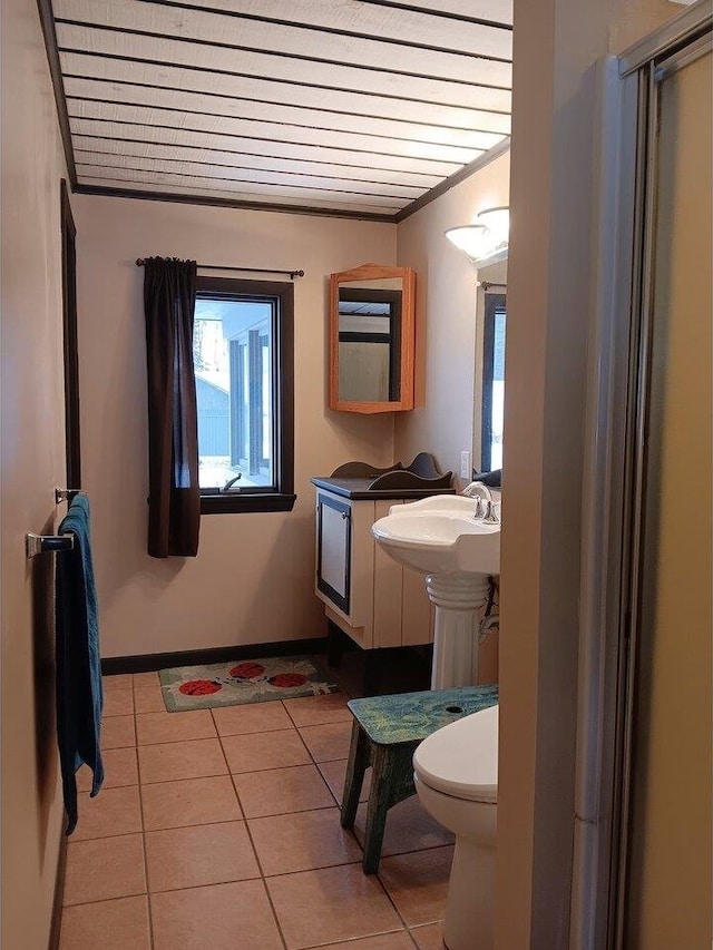 bathroom with sink, tile patterned flooring, wooden ceiling, and toilet