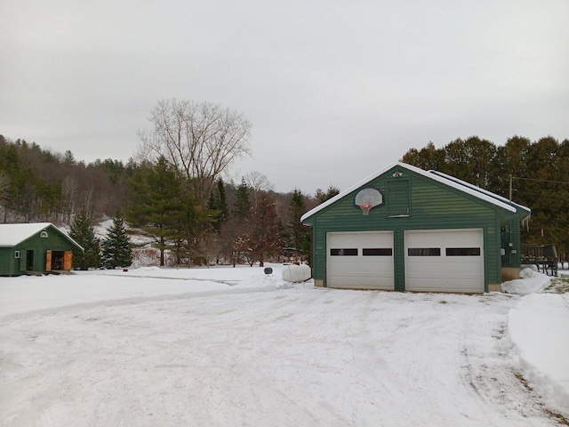 view of snow covered garage