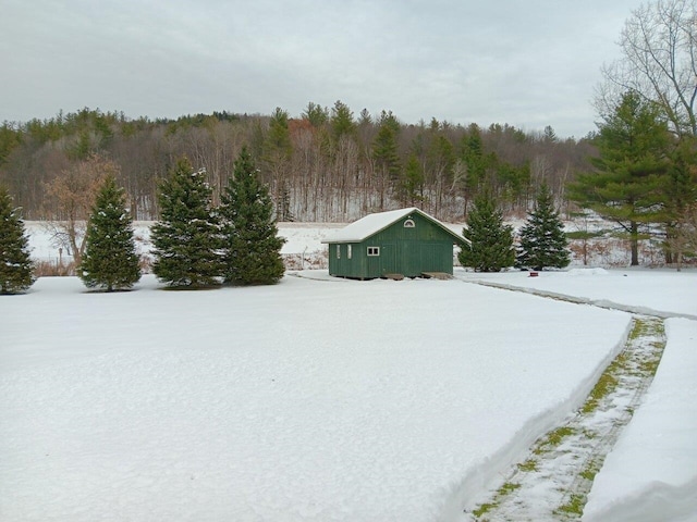 snowy yard with an outdoor structure