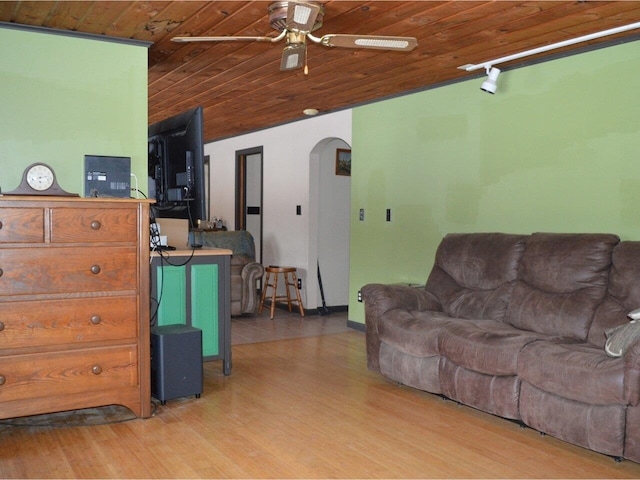 living room featuring ceiling fan, light hardwood / wood-style floors, and wooden ceiling