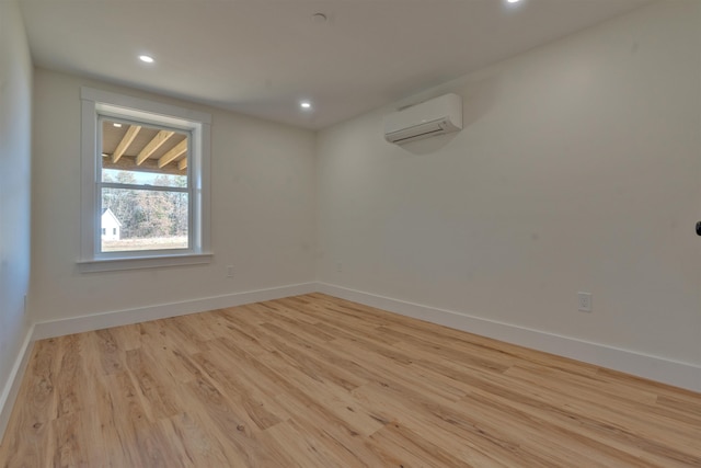 17 Durant Rd, Berwick, ME 03901 - empty room featuring a wall unit AC, wood finished floors, and recessed lighting