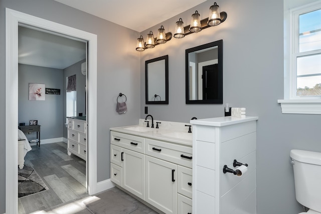 19 Whippoorwill Way, Somersworth, NH 03878 - ensuite bathroom featuring two vanities and wood finished floors