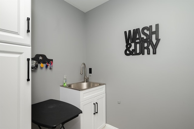 19 Whippoorwill Way, Somersworth, NH 03878 - laundry area with a sink and baseboards