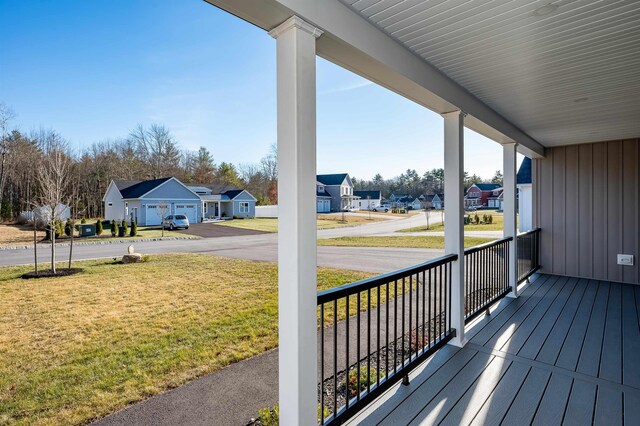 19 Whippoorwill Way, Somersworth, NH 03878 - wooden porch featuring a residential view and a yard