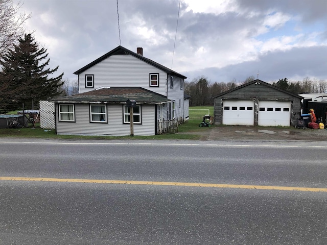 view of front of house featuring an outbuilding and a garage