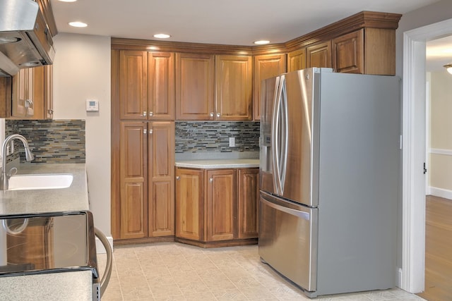 kitchen with decorative backsplash, sink, stainless steel appliances, and island range hood