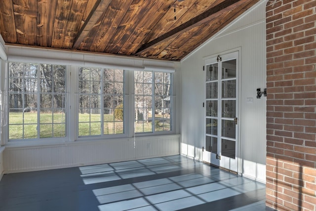 unfurnished sunroom with lofted ceiling and wood ceiling