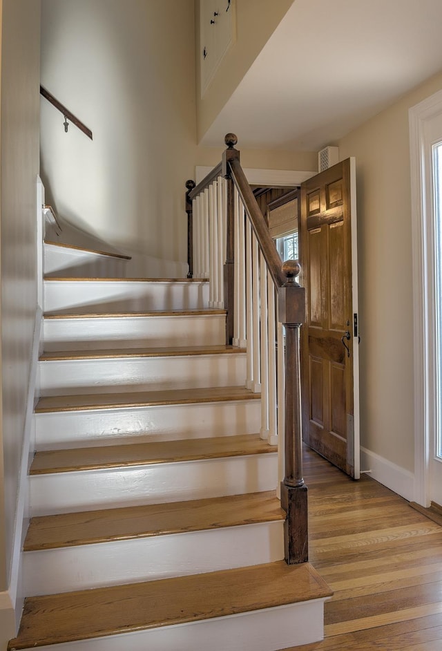 stairs with wood-type flooring