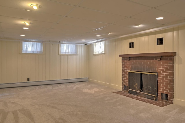 basement with a fireplace, carpet, and a baseboard radiator