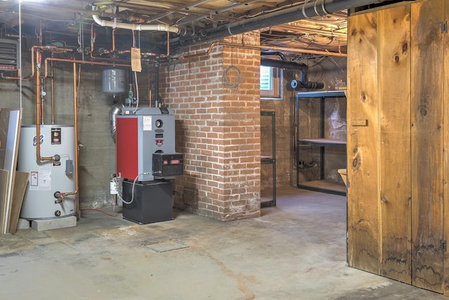 utility room with gas water heater