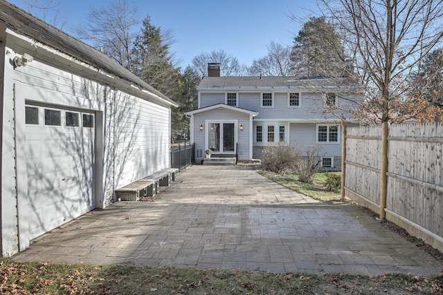 back of house with a garage