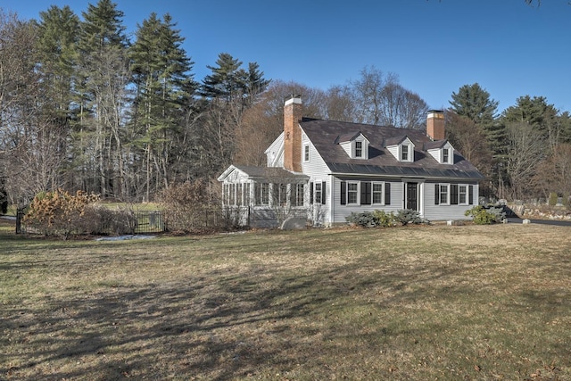 new england style home with a front lawn