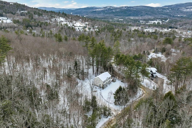 snowy aerial view featuring a mountain view