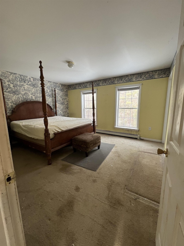 carpeted bedroom with a baseboard radiator