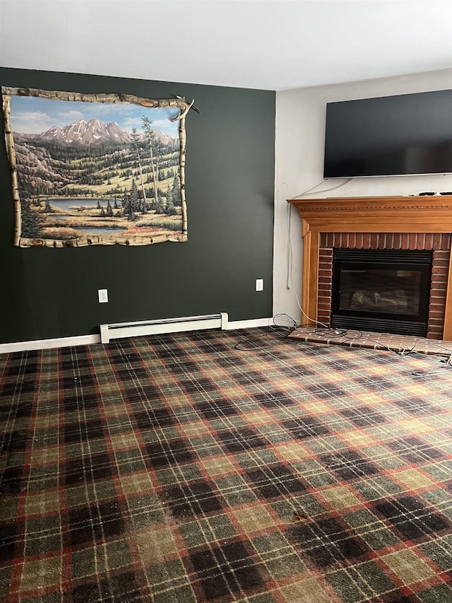 unfurnished living room featuring a fireplace and a baseboard heating unit