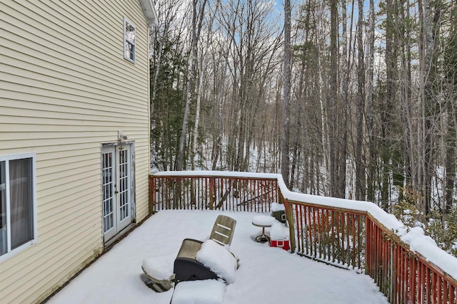 view of snow covered deck