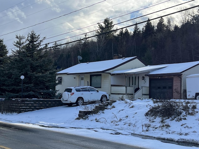 single story home featuring a garage