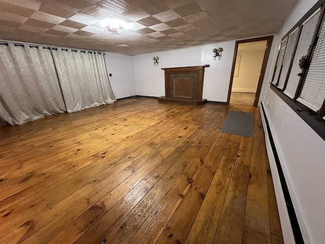 interior space featuring hardwood / wood-style flooring and baseboard heating