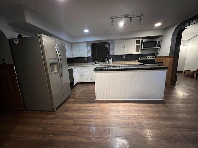 kitchen with white cabinetry, stainless steel appliances, dark hardwood / wood-style flooring, and sink