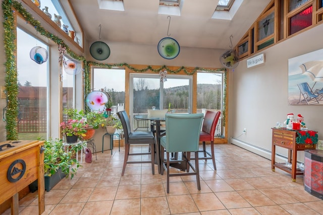 interior space featuring a baseboard heating unit and a skylight