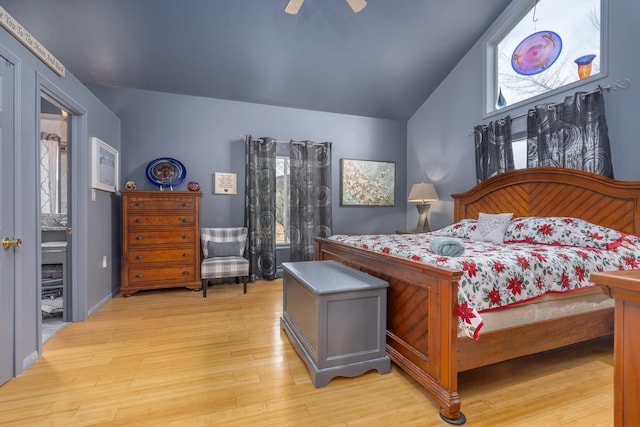 bedroom featuring vaulted ceiling, light wood-type flooring, and ceiling fan