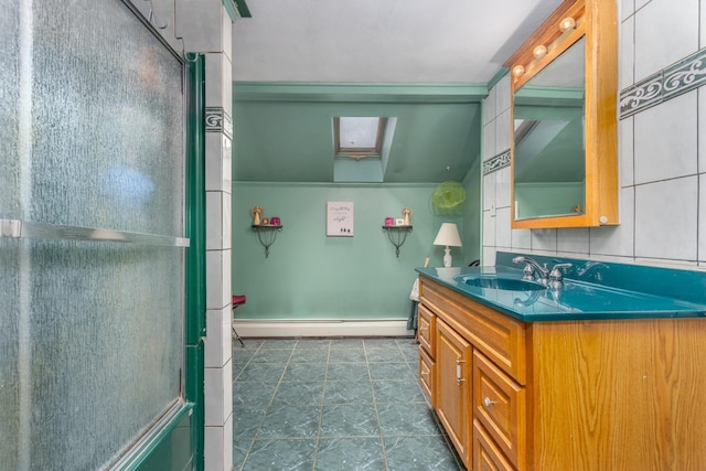 bathroom with a baseboard heating unit, a skylight, a shower with shower door, and vanity