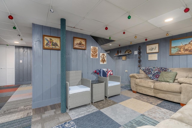 living room with a drop ceiling