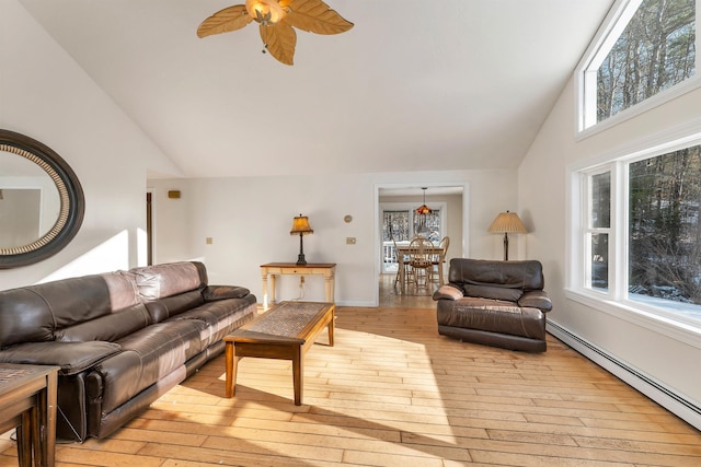 living room with high vaulted ceiling, light hardwood / wood-style flooring, baseboard heating, and ceiling fan