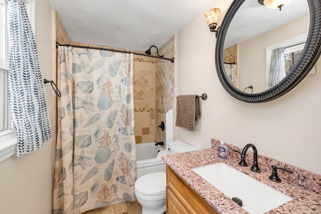 full bathroom with vanity, toilet, and shower / bath combo with shower curtain