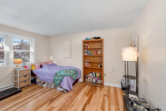 bedroom with hardwood / wood-style flooring