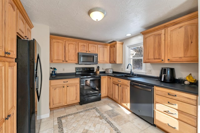 kitchen featuring a textured ceiling, sink, and black appliances