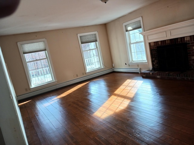 unfurnished living room featuring a fireplace, a baseboard radiator, and dark hardwood / wood-style floors