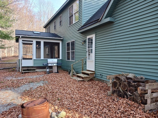 back of property featuring a sunroom