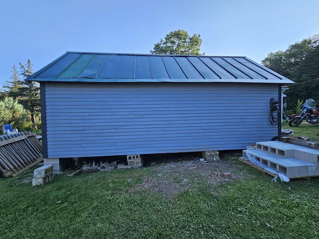 garage featuring a yard