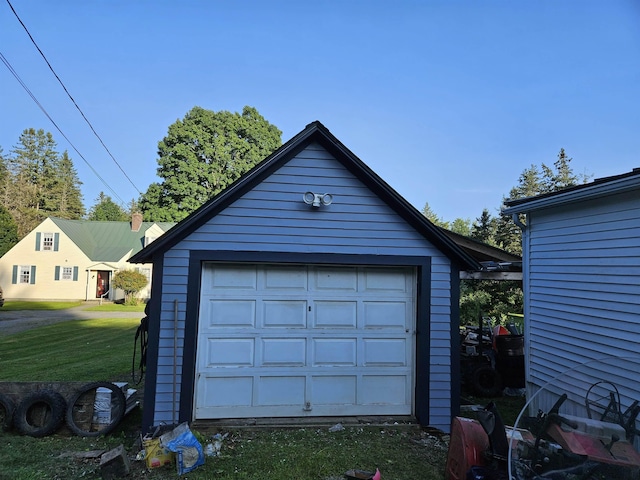 garage featuring a yard