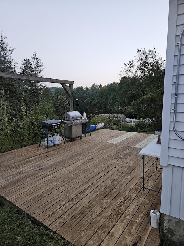 wooden terrace featuring grilling area