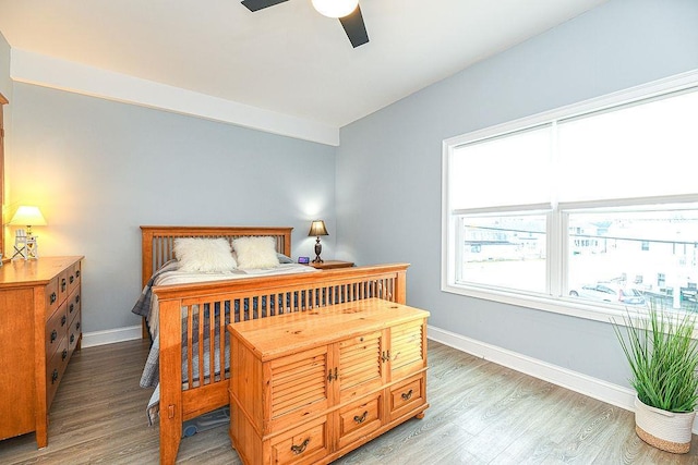 bedroom featuring hardwood / wood-style flooring and ceiling fan