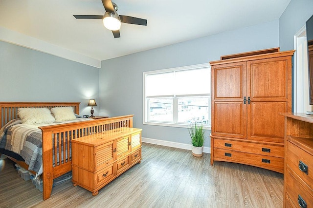 bedroom featuring ceiling fan and light wood-type flooring