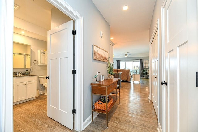 corridor featuring light hardwood / wood-style floors