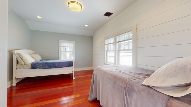 1091 US Route 2, North Hero, VT 05474 - bedroom featuring multiple windows, lofted ceiling, and dark hardwood / wood-style floors